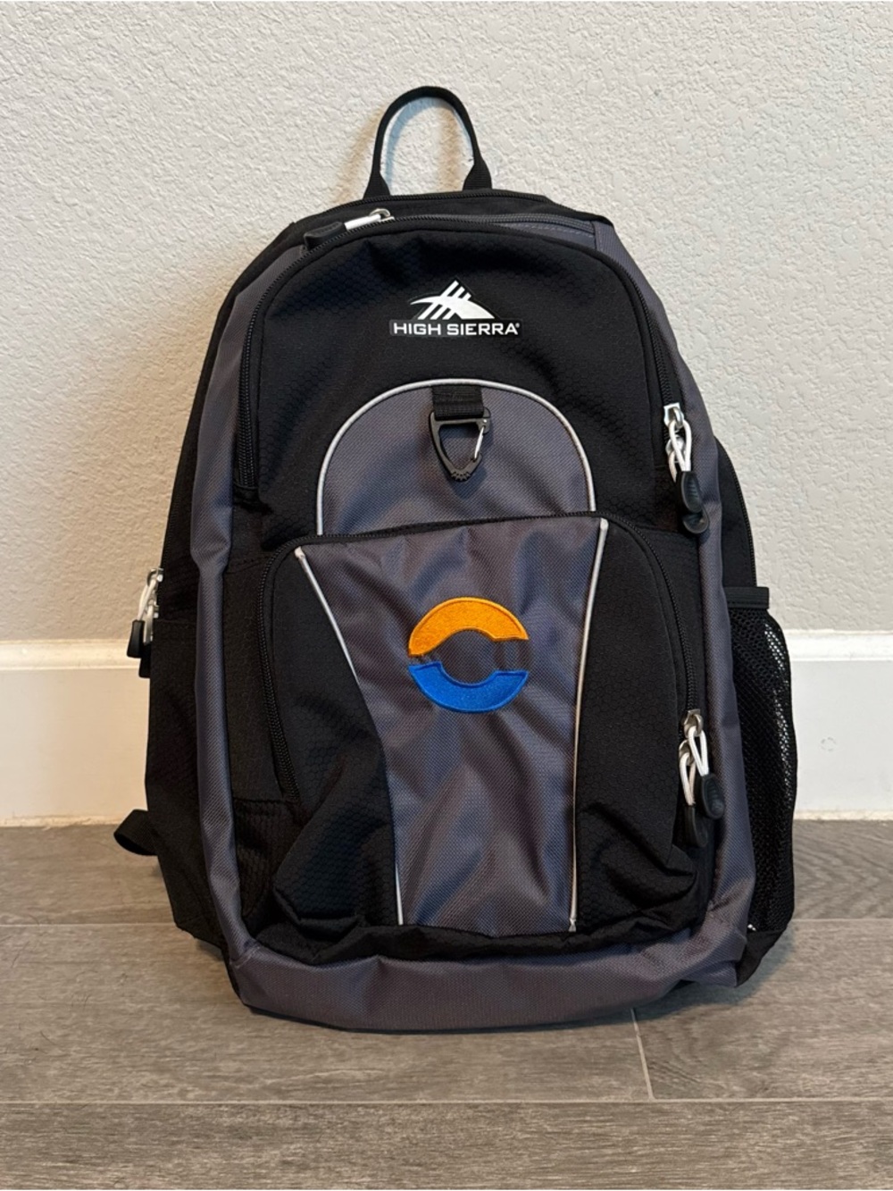 High Sierra Black and Gray Backpack with Blue and Orange Logo